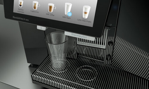 External hot water outlet for tea on coffee machine
