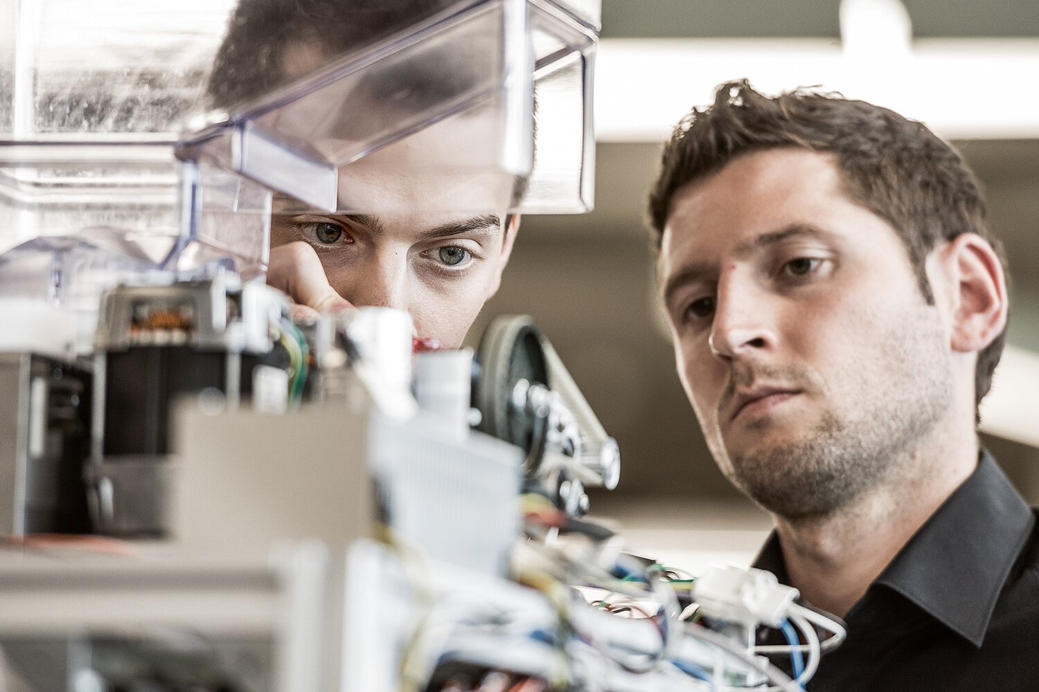 Engineers test the technology of a coffee machine