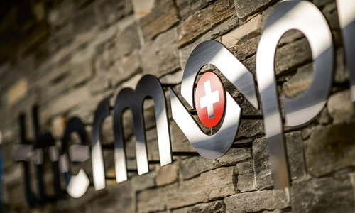 Thermoplan company logo on stone wall