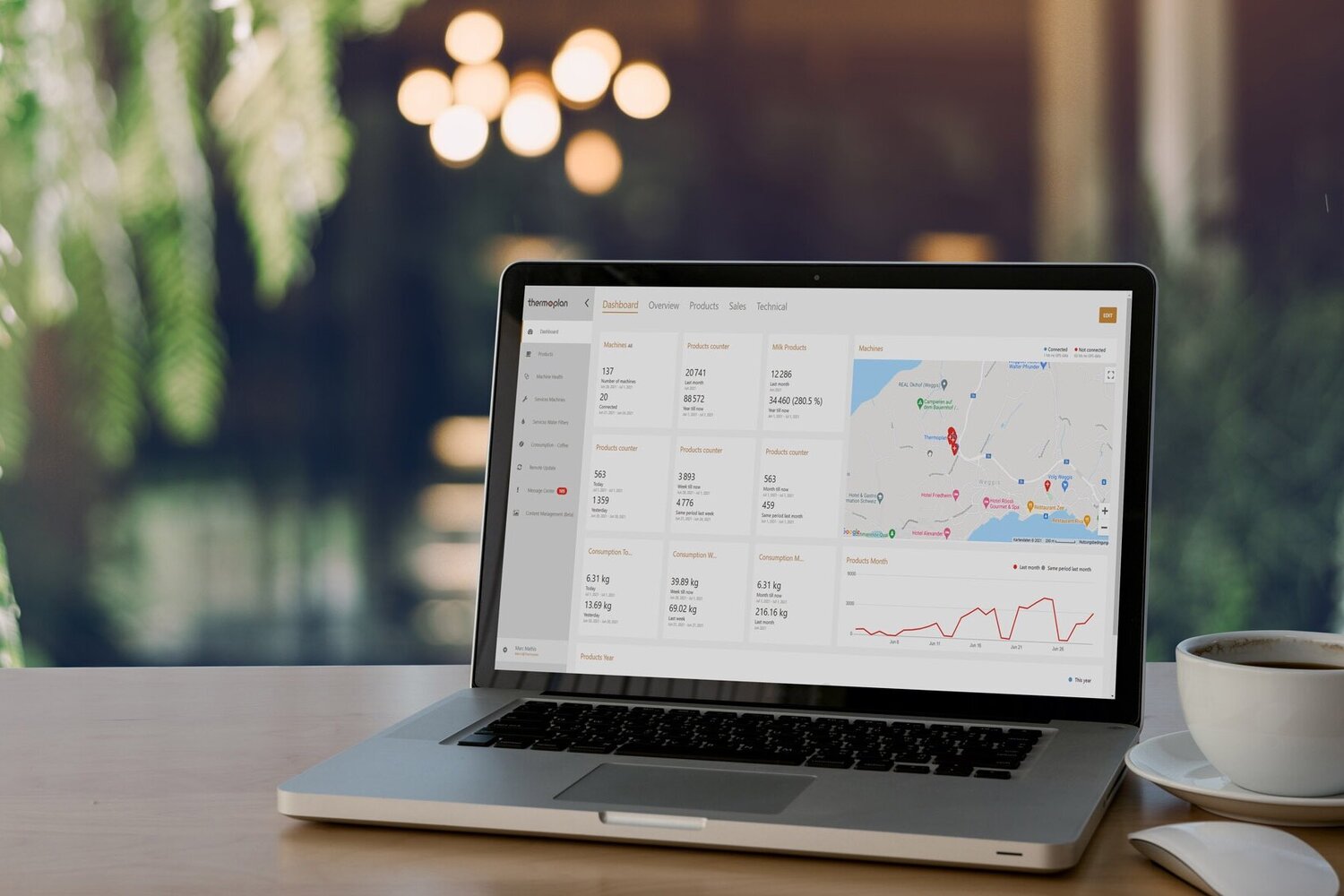 Laptop with ThermoplanConnect telemetry system on wooden table with coffee cup
