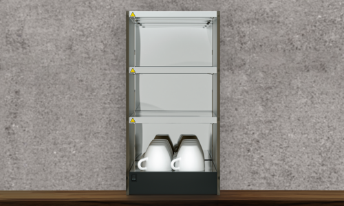 Cup warmer with coffee cups on wooden table with stone wall in the background